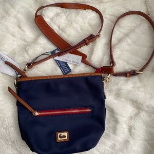 Dooney and Bourke crossbody bag. Navy w/ blue and white stripe lining. New!